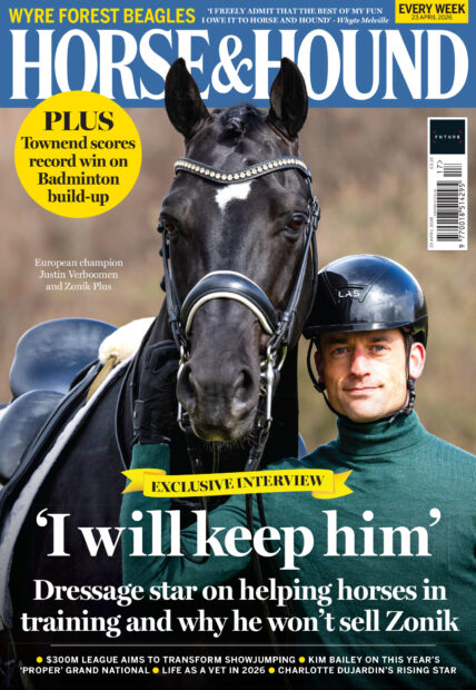 Cover of Horse & Hound, featuring a Justin Verboomen in green wearing a riding hat holding the bridle of black stallion Zonik Plus. Zonik has a white star.