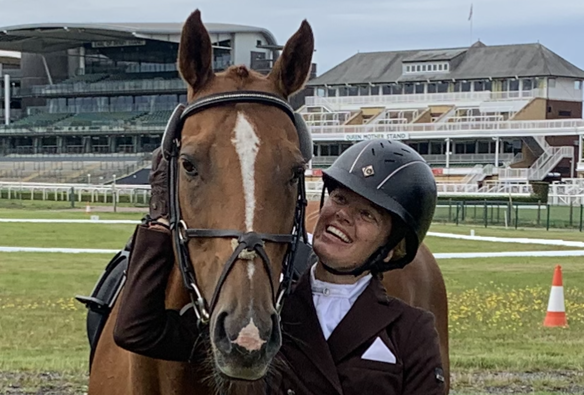 Sarah and her former racehorse Feed The Goat, pictured at the Retraining of Racehorse championships at Aintree. 