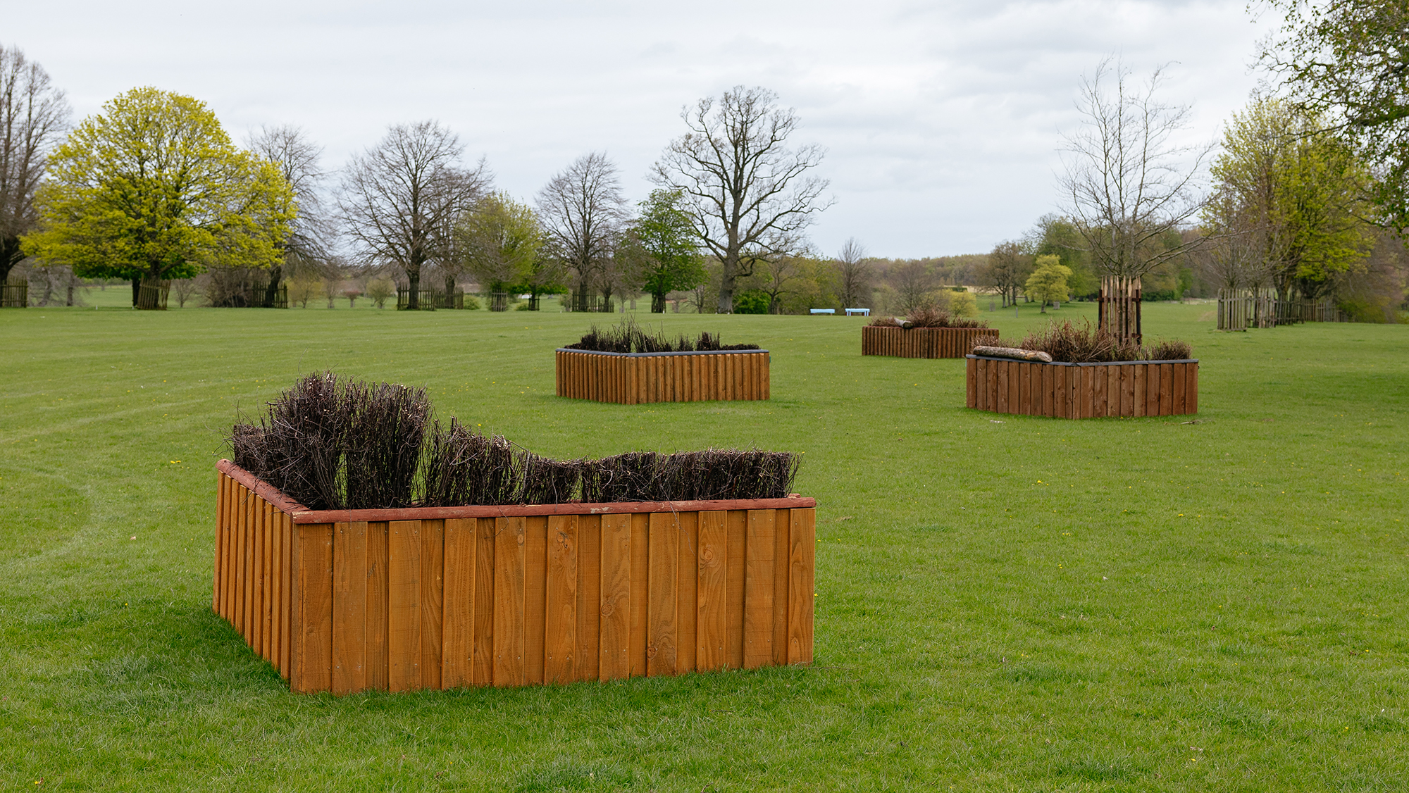 Four arrow brush fences set in the Badminton grounds for the LeMieux Grassroots Championships. 