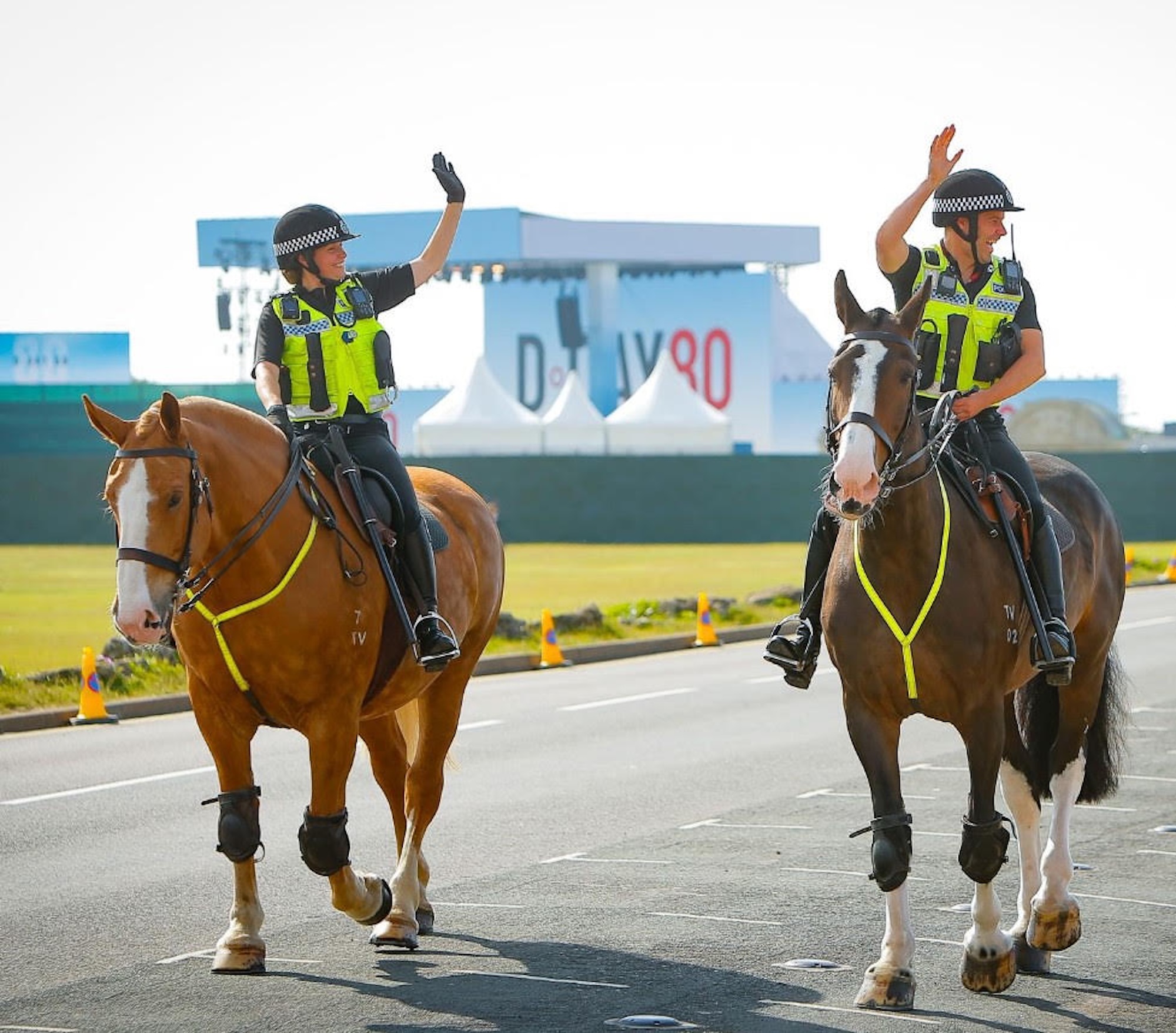 Police Horse Luna on patrol on a road with Heidi Cornick and Atlas