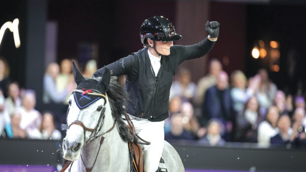Jessica Burke punches the air after her round in World Cup qualifier