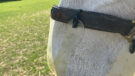 Close up of cable tie fitting on Thinline grazing muzzle on a horse
