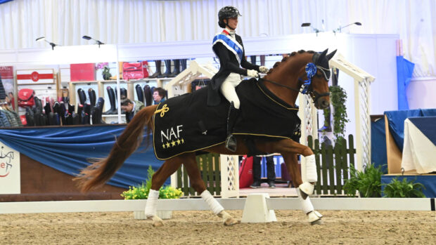 Demi Howard-Cartwright riding her horse Newton Astro Nascente in the prize-giving at Addington after winning the prix st georges silver at the Winter Dressage Championships.