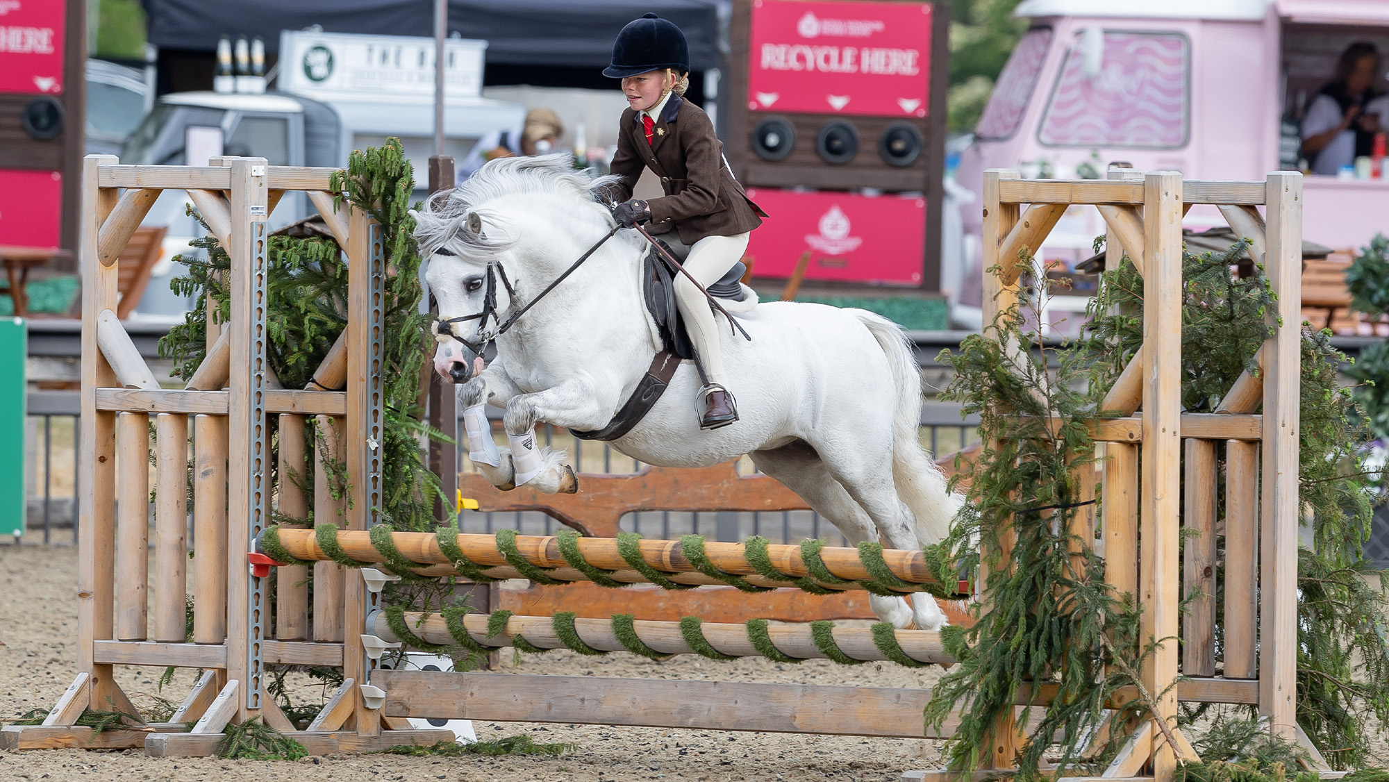 Poppy Rowlands riding Delami Brvado in the M&M working hunter pony class at Royal Windsor Horse Show
