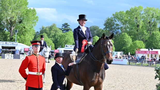 Charlotte Clark and Harbourmaster II stand for a photo after they claim 2026 Windsor ladies hunter title