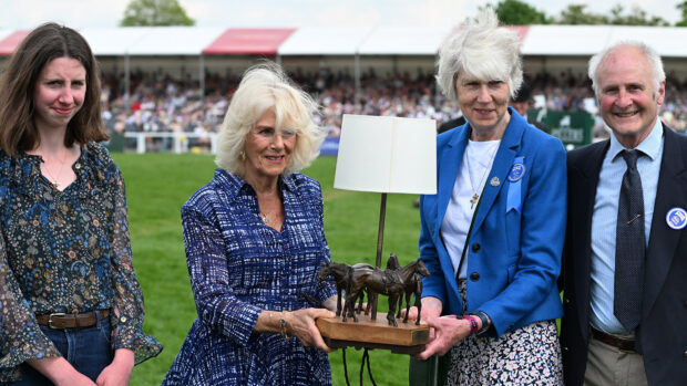 The Queen at Badminton Horse Trials in 2024, making a presentation to event director Jane Tuckwell to mark her 50 years working at the event.