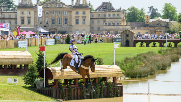 Emily King jumps Valmy Biats into water in front of the house at Badminton Horse Trials