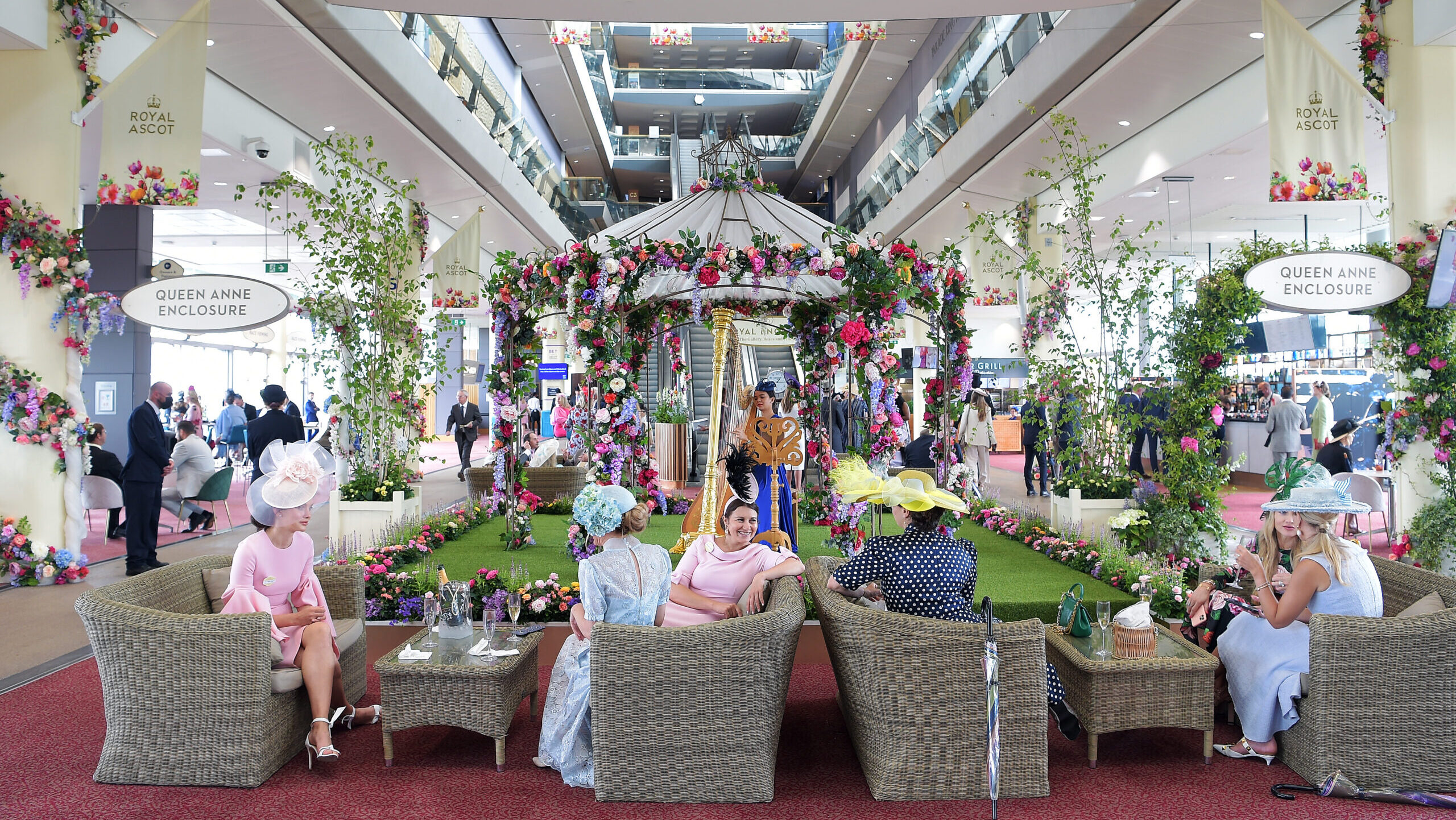 Racegoers relax within the Queen Anne Enclosure at Royal Ascot