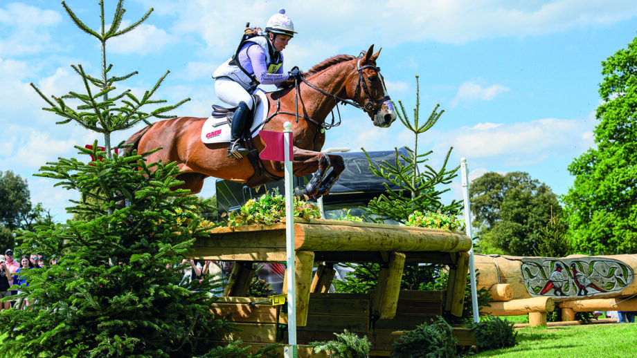Gemma Stevens and Chilli Knight jump a cross-country fence at Badminton 2025.