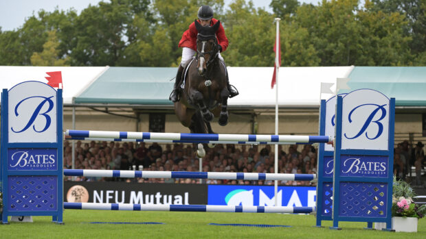 Tim Price and Annaghmore Valoner clear a showjump at Burghley 2025.