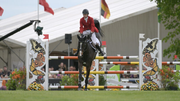 Harry Meade and Annaghmore Valoner jump a fence in the showjumping on the way to third at Badminton 2026.