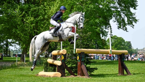 Holly Richardson and Ballyneety Silver Service jump a cross-country fence at Badminton Horse Trials 2026.