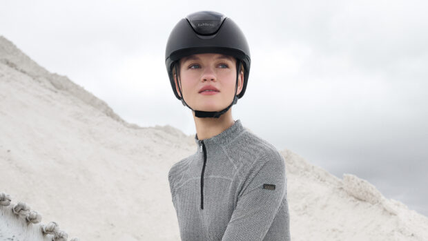 Lady riding wearing a LeMieux Verv riding helmet