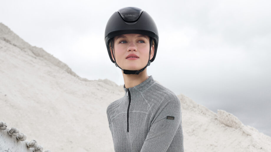 Lady riding wearing a LeMieux Verv riding helmet