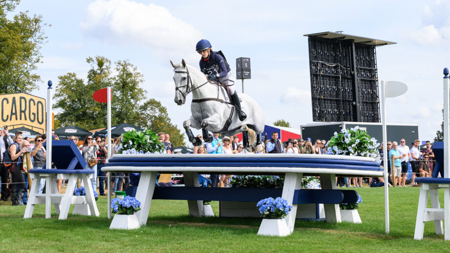 Holly Richardson and Ballyneety Silver Service jump a cross-country fence at Burghley 2025.