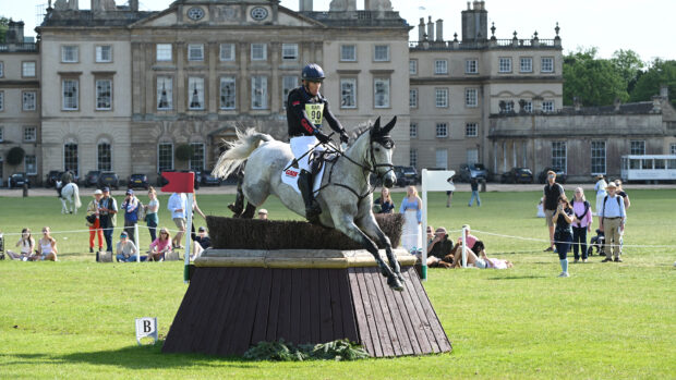 Oliver Townend and Cooley Rosalent jump a cross-country fence in front of the house at Badminton Horse Trials 2025.