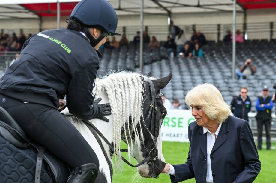 The Queen speaking to an Ebony Horse Club rider in the main Badminton arena