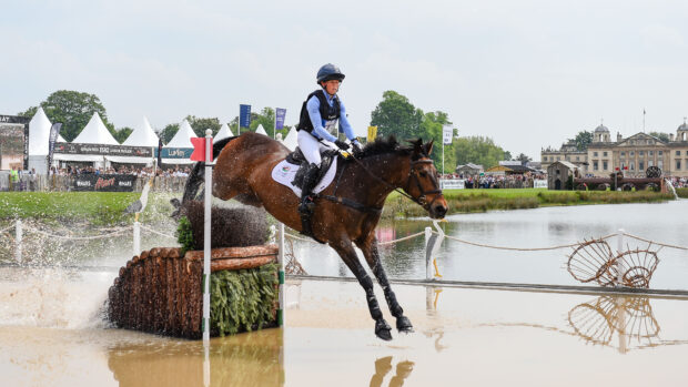 Ros Canter and Lordships Graffalo jump a fence in The Lake on the cross-country at Badminton Horse Trials.