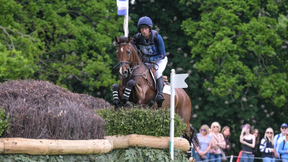 Tim Price and Falco jump a cross-country fence at Badminton 2026.
