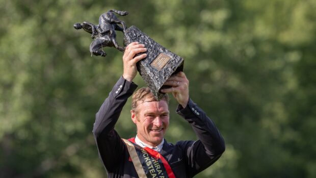 William Whitaker holds up the Boomerang trophy