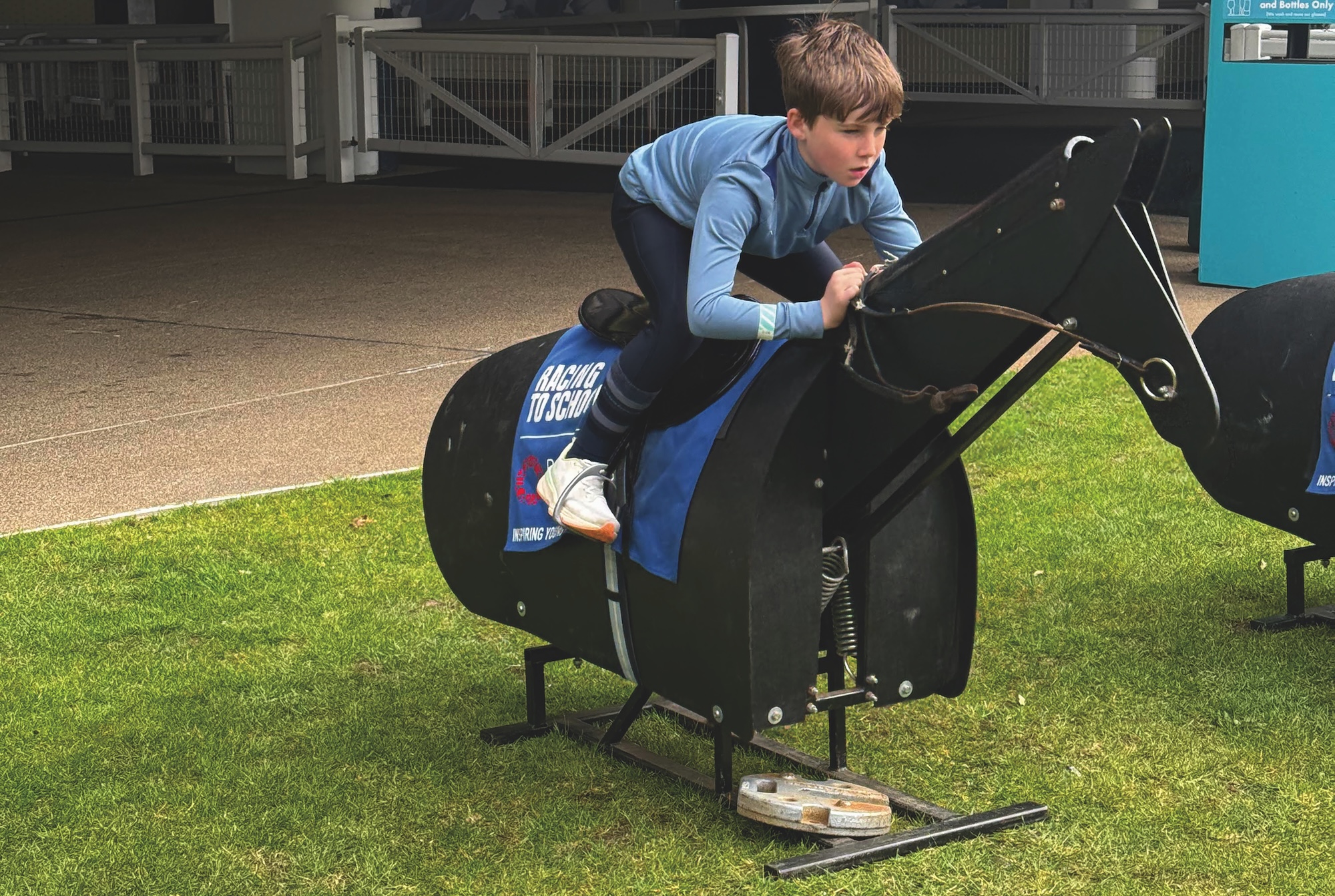 Pony racing taster day, boy riding mechanical horse