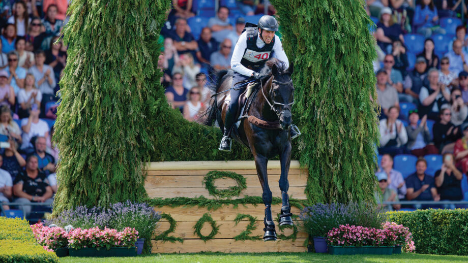 Jérôme Robiné and Black Ice jump a cross-country fence at Aachen 2025.