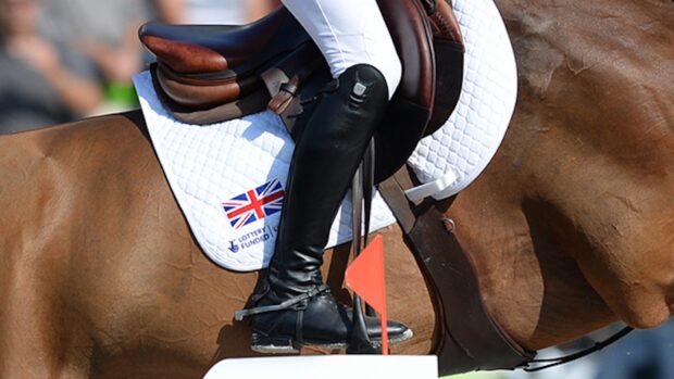 A close-up of a British flag on a showjumping saddlecloth