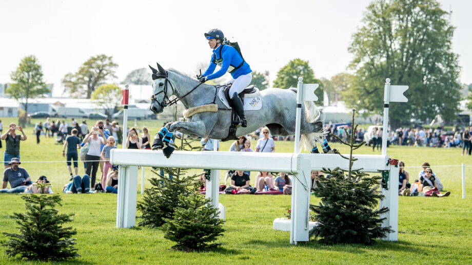 Dani Stewart-Richardson (née Evans) and Smart Time jump a cross-country fence made of white rails at Badminton 2018.