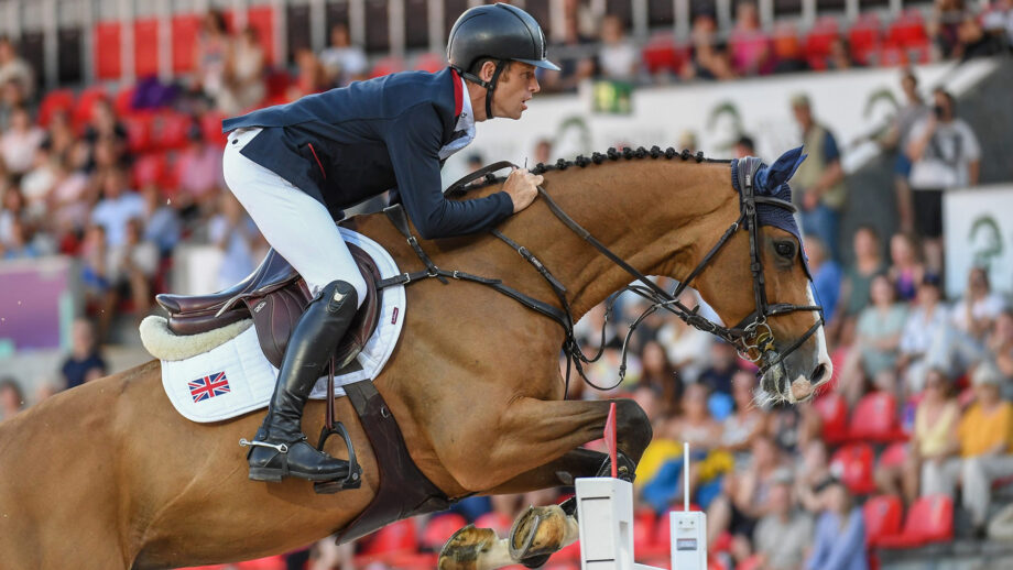 A close up image of British showjumper Scott Brash clearing a fence with Hello Jefferson at the 2022 World Championships