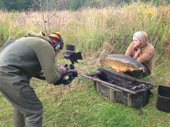 Pointing the camera at Marian Sura with a gorgeous German common carp