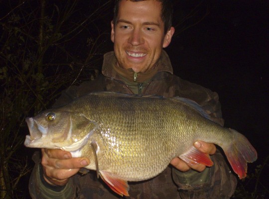 Specimen ace Neill Stephen is another top angler who takes brilliant photos. He stars in this one, however, with his record perch. It's a great example of a quality night shot with good composition and lighting.