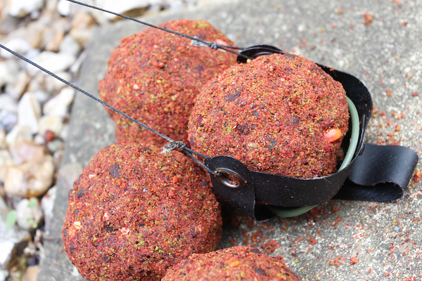 I prefer to use a Gardner sling-shot when baiting up yet a spomb, spod, even a bait boat can be used.