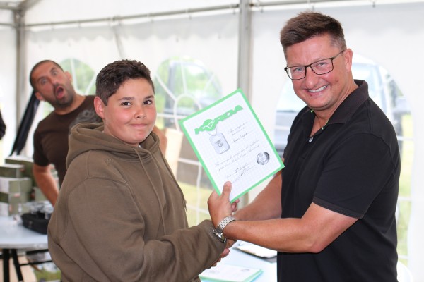 Students were presented with a signed certificate upon graduating. Pictured is Ryan Taylor collecting his certificate from Danny Fairbrass.