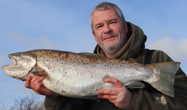 Specimen fishing ace Tony Gibson displays his giant brown trout.