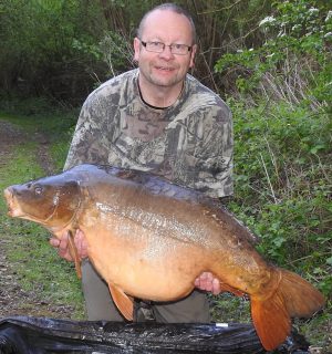 Andy Matthews cradles his 61 lb Wingham specimen.