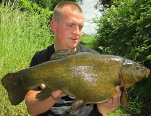 Joe Royffe admires his 10 lb 6 oz tench.