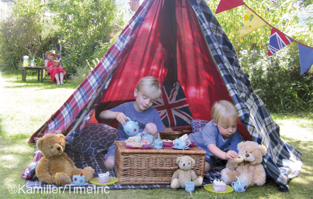 Building a teepee tent in the garden with the children