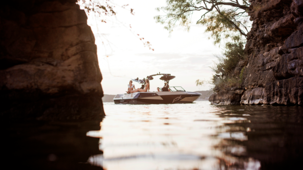 The boat in the middle of the image on the water