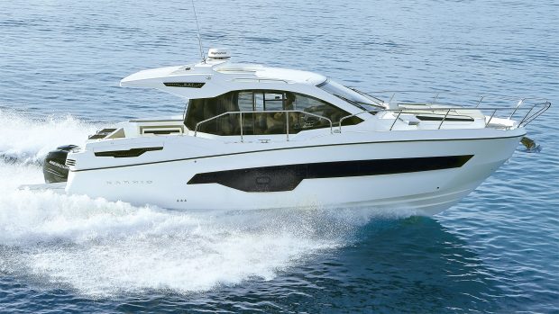Side profile shot of the little motorboat whizzing in some water.