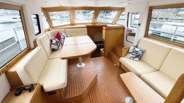 A bright, sociable saloon leads down to a sunken forward galley