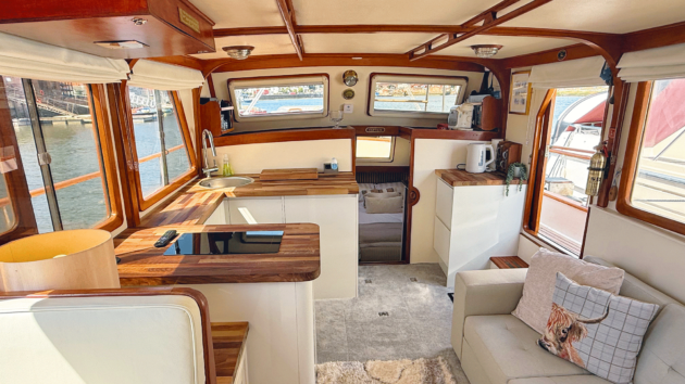The finished saloon has a modern fitted kitchen from Howdens and a clever convertible sofabed