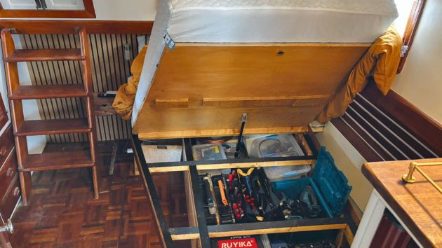 Ross designed and built the aft cabin bed himself with space for his tools under the mattress