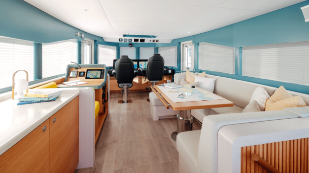 The upper deck houses the main helm and a separate navigation station