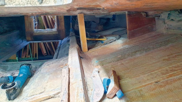 The refitters had to chock up the deck while a new water conduit was fitted