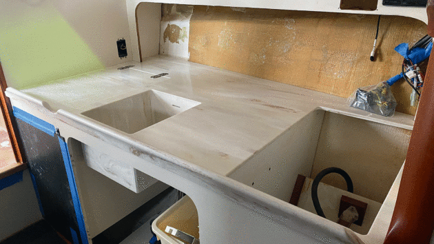 The galley worktop was machined to accept the existing fridge and hob