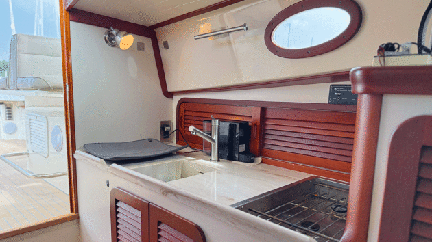 Modern Corian worktop and taps add a new lease of life to the original galley 