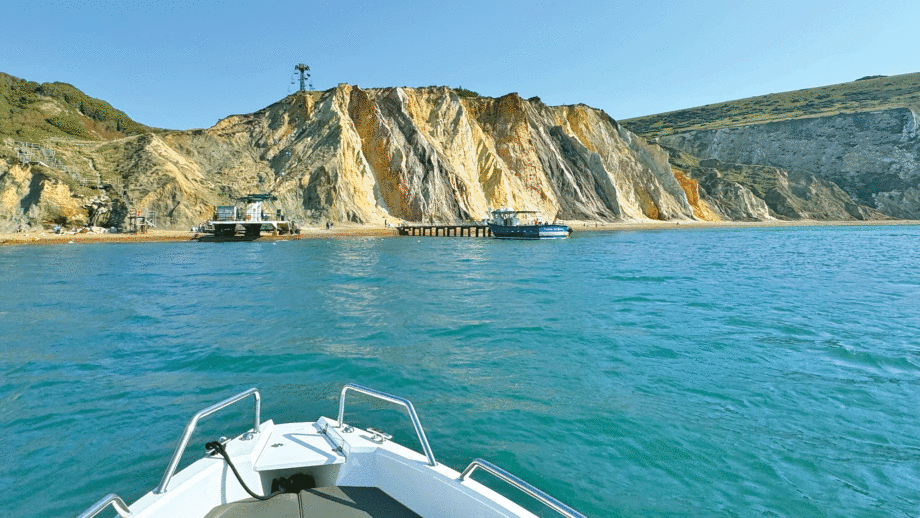 POV on a boat and looking at the cliffs