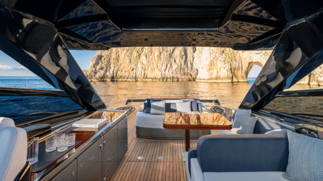 A long wet bar and two seating zones nestle beneath the hardtop