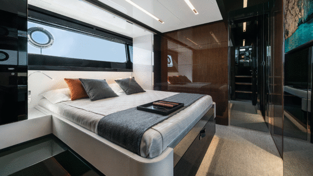 The owner's transverse bed looks across to a port bathroom