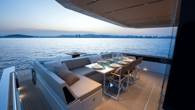 A big sheltered dinette butts up against the raised aft sunbed